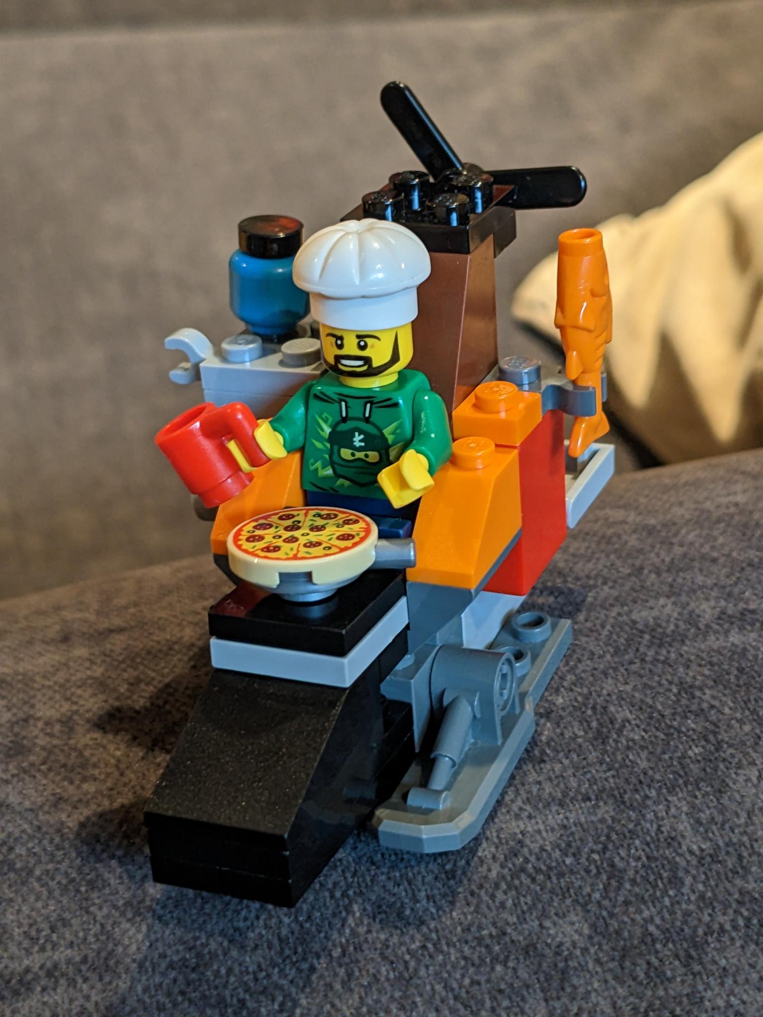 This is Lego John riding a hover bike full of food.