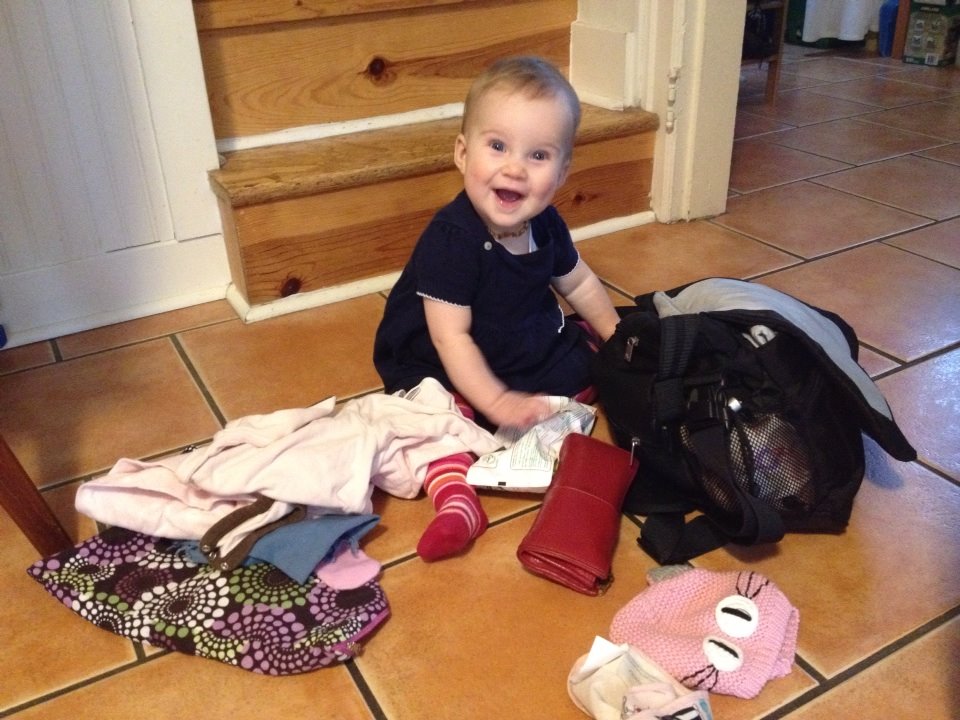 Millie is in awe of many things. Like her mom's purse and all the treasures within!